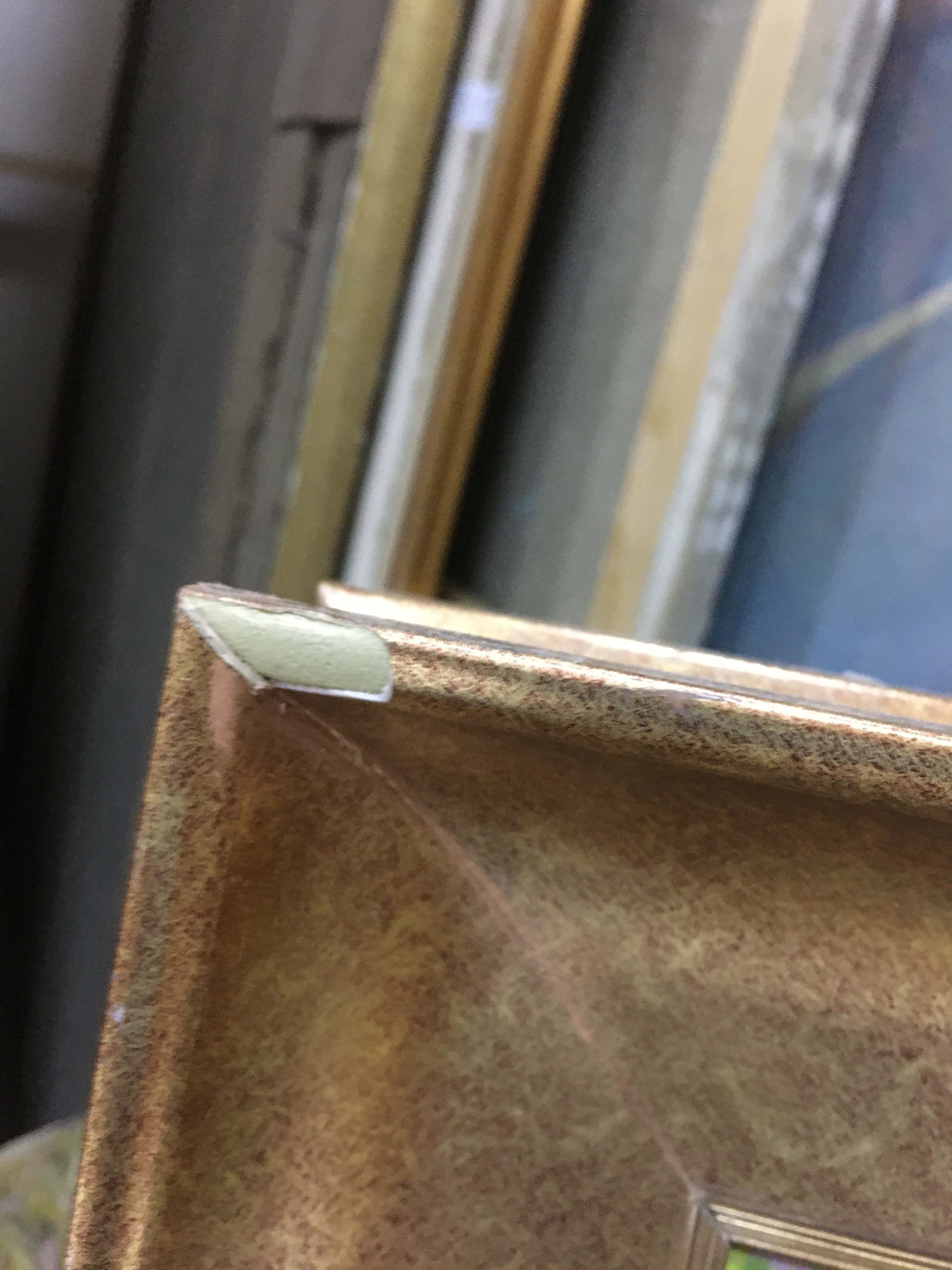 Gold-toned textured frame with white corner protector for Lilac Chegodar oil painting