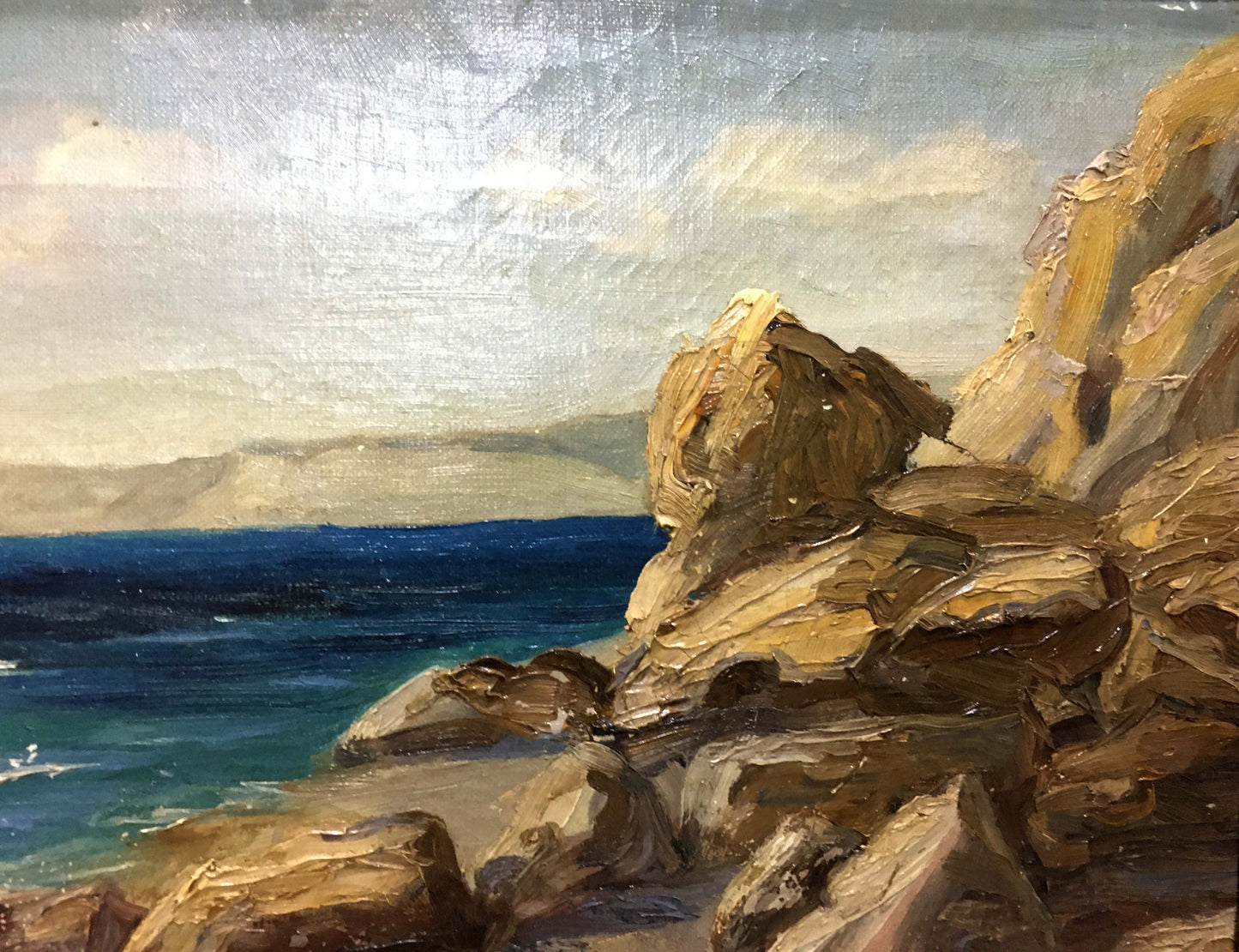 Oil painting by Stepan Yarovoy: rugged rocks by blue ocean