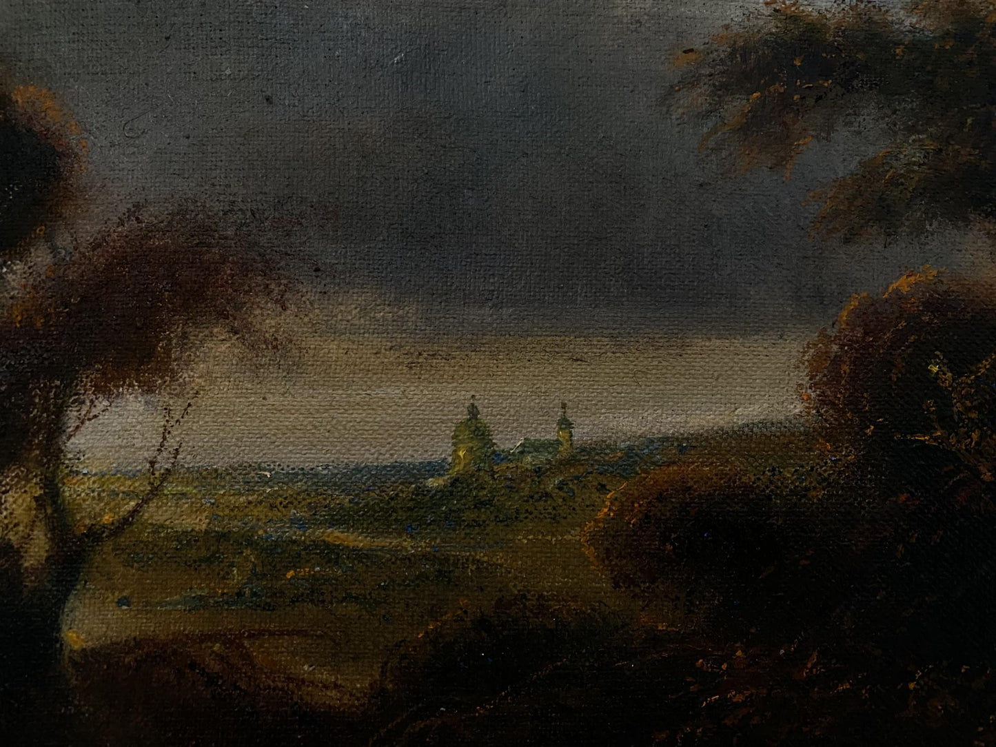Dark atmospheric oil painting by Litvinov Oleg Arkad’yevich: stormy village and silhouetted trees