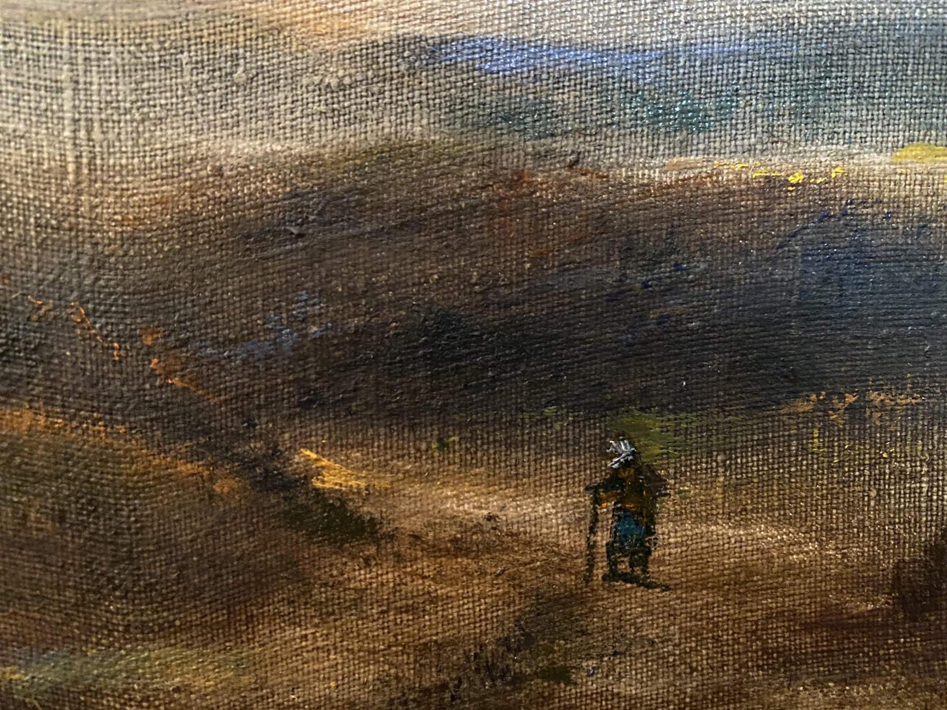 Oil painting Before the Rain by Litvinov Oleg Arkad’yevich, solitary figure in dark clothing on rugged landscape under textured sky