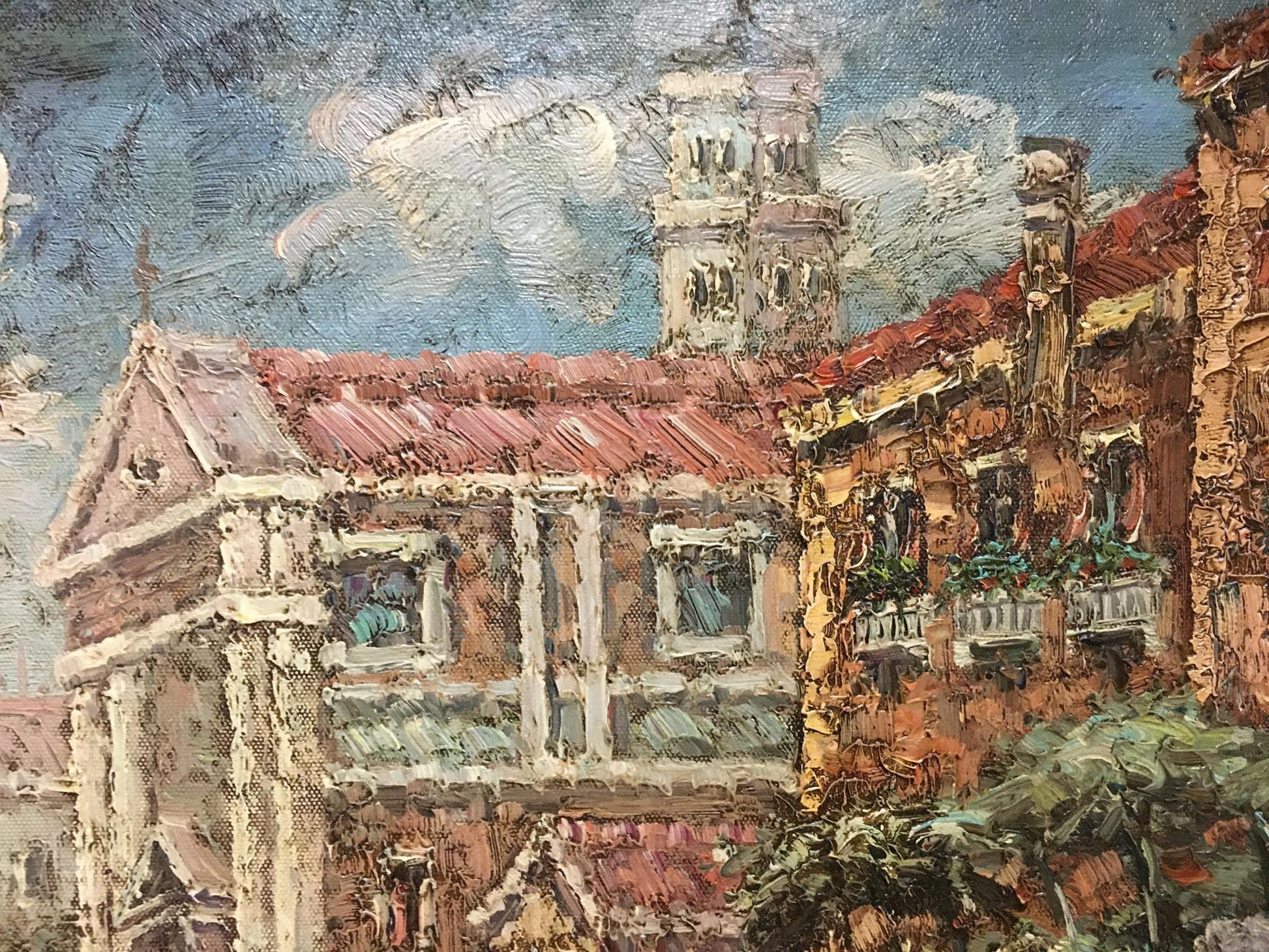Oil painting of summer city landscape with terracotta roofs and stone tower