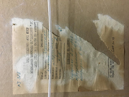 Back of Glushchenko oil painting with torn beige Cyrillic document