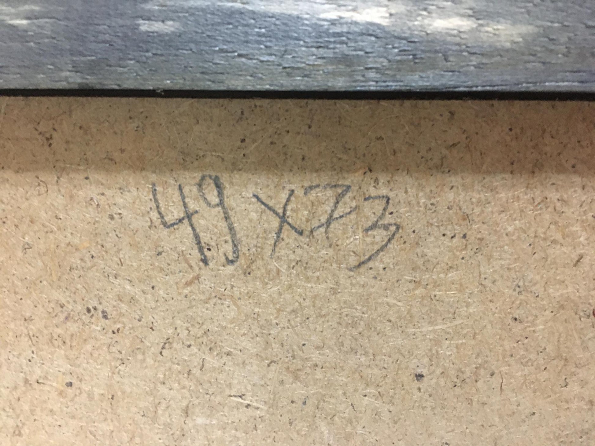 Back of Anatoly Fomin oil painting Forest landscape with handwritten 49 x 73 inch dimensions on beige particle board