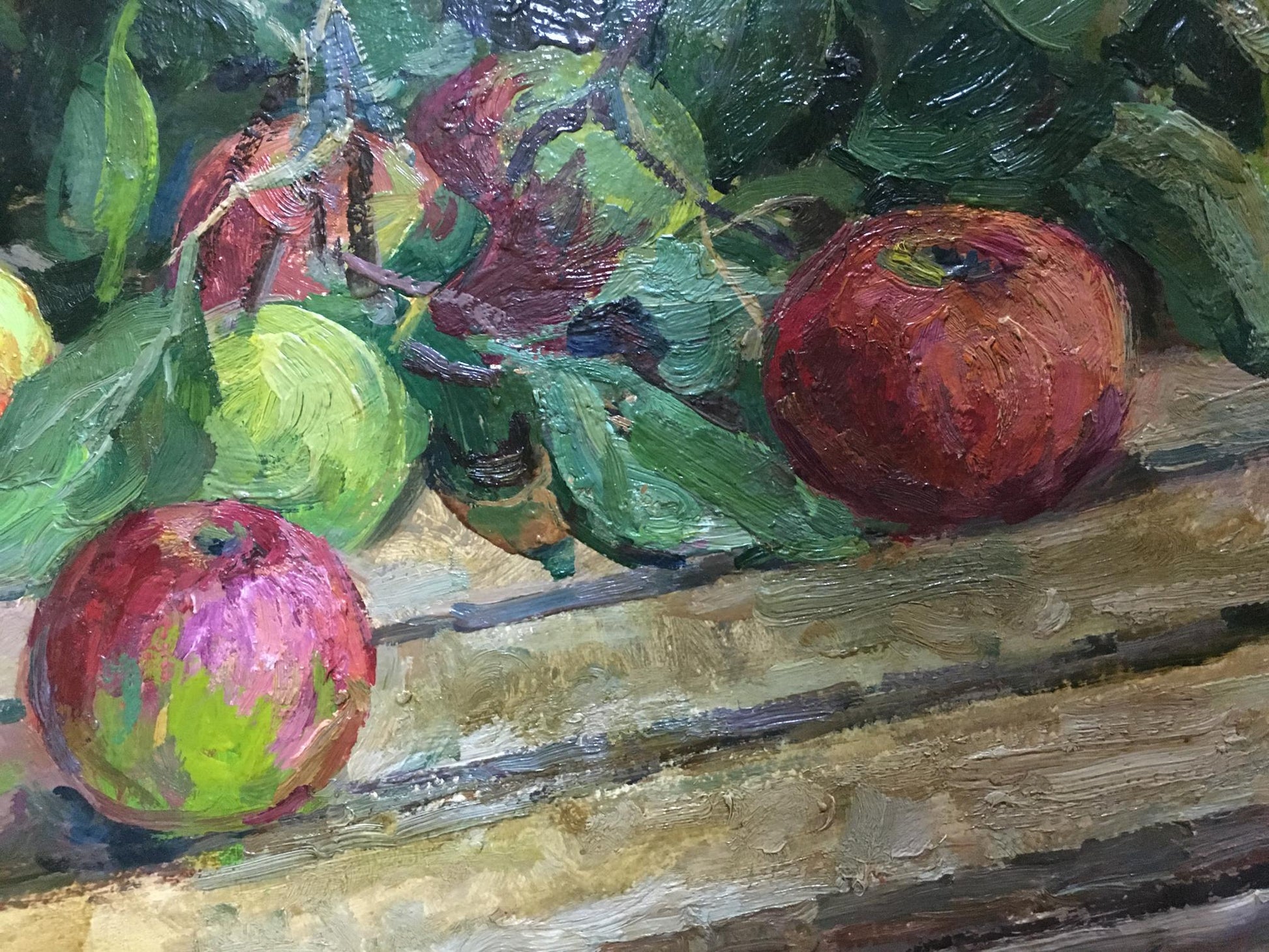 Vibrant impressionistic oil painting of red and green apples on wood