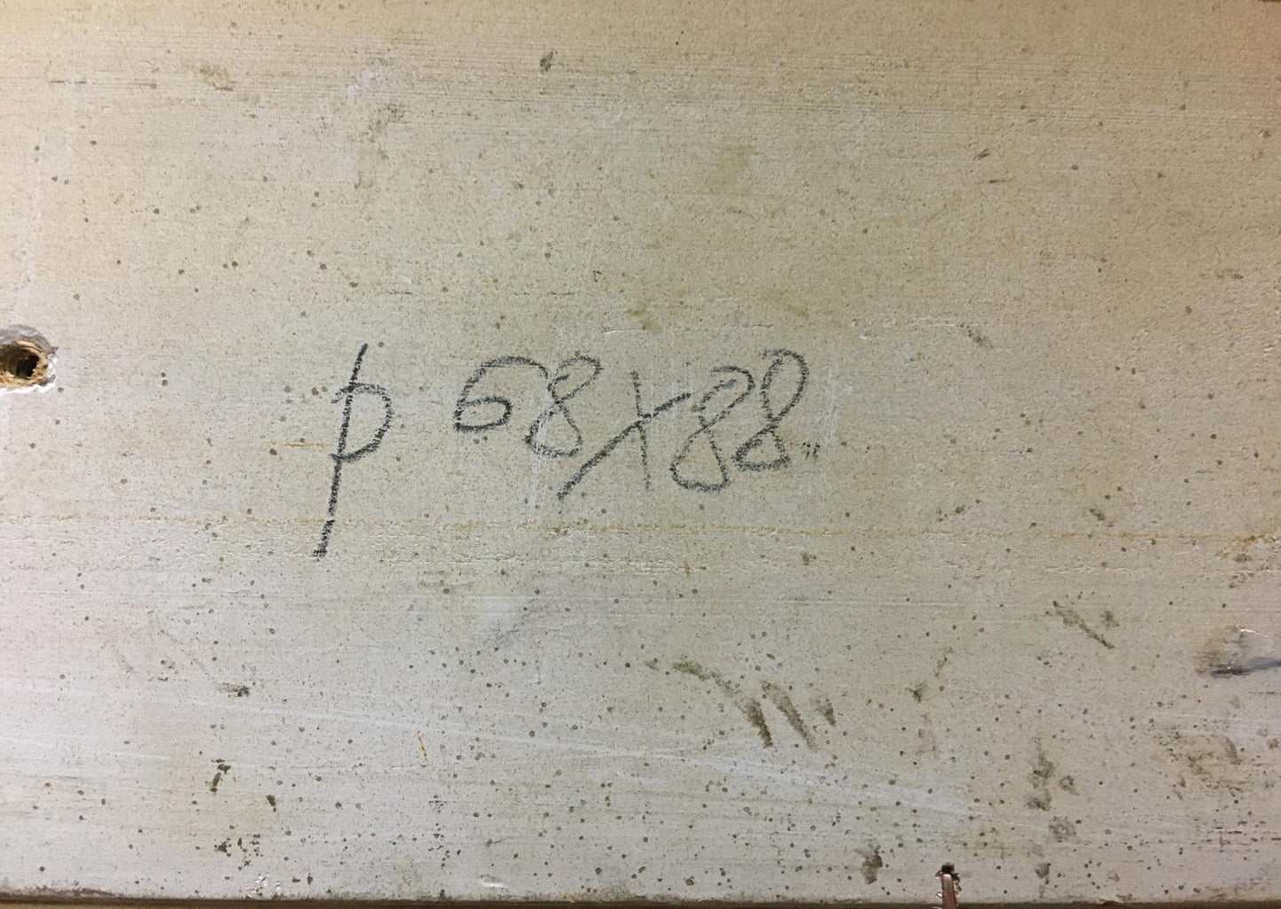 Handwritten markings on weathered concrete back of Zakharov oil painting