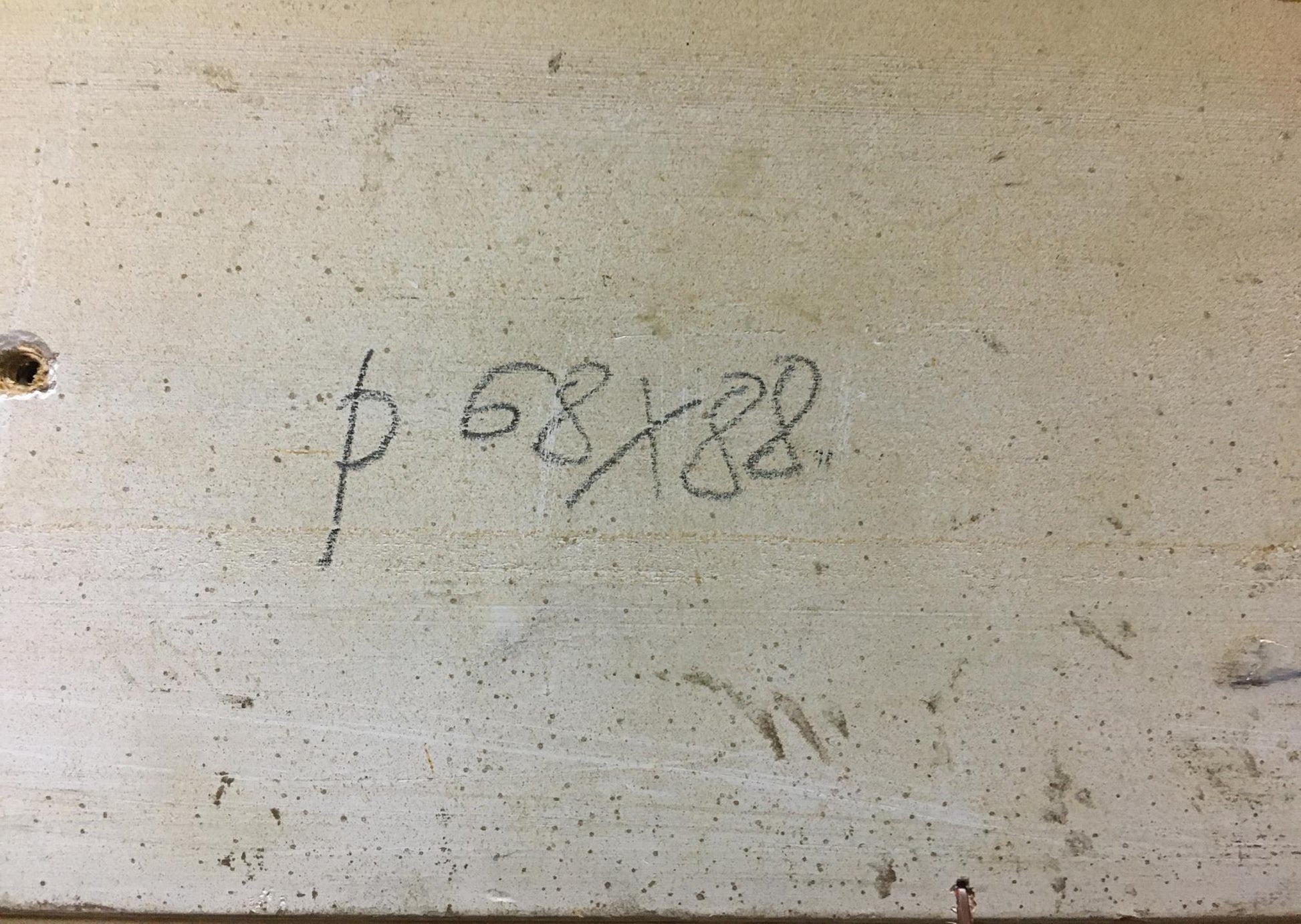 Handwritten markings on weathered concrete back of Zakharov oil painting