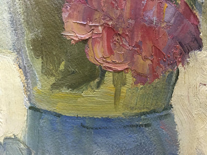 A textured oil painting of a vibrant red and pink flower arrangement in a greenish-yellow vase.