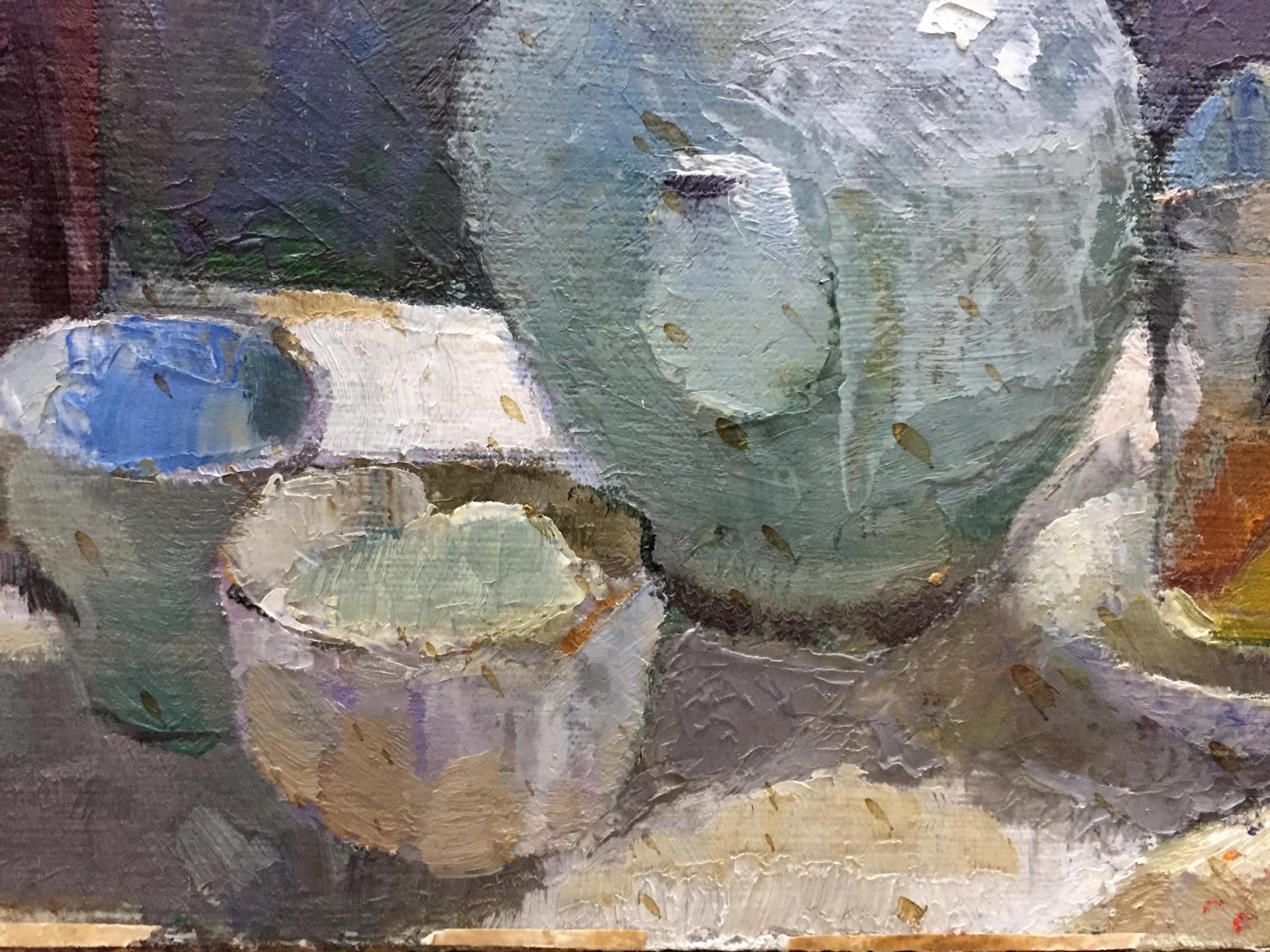 Textured light teal ceramic teapot with rounded body and brushstrokes