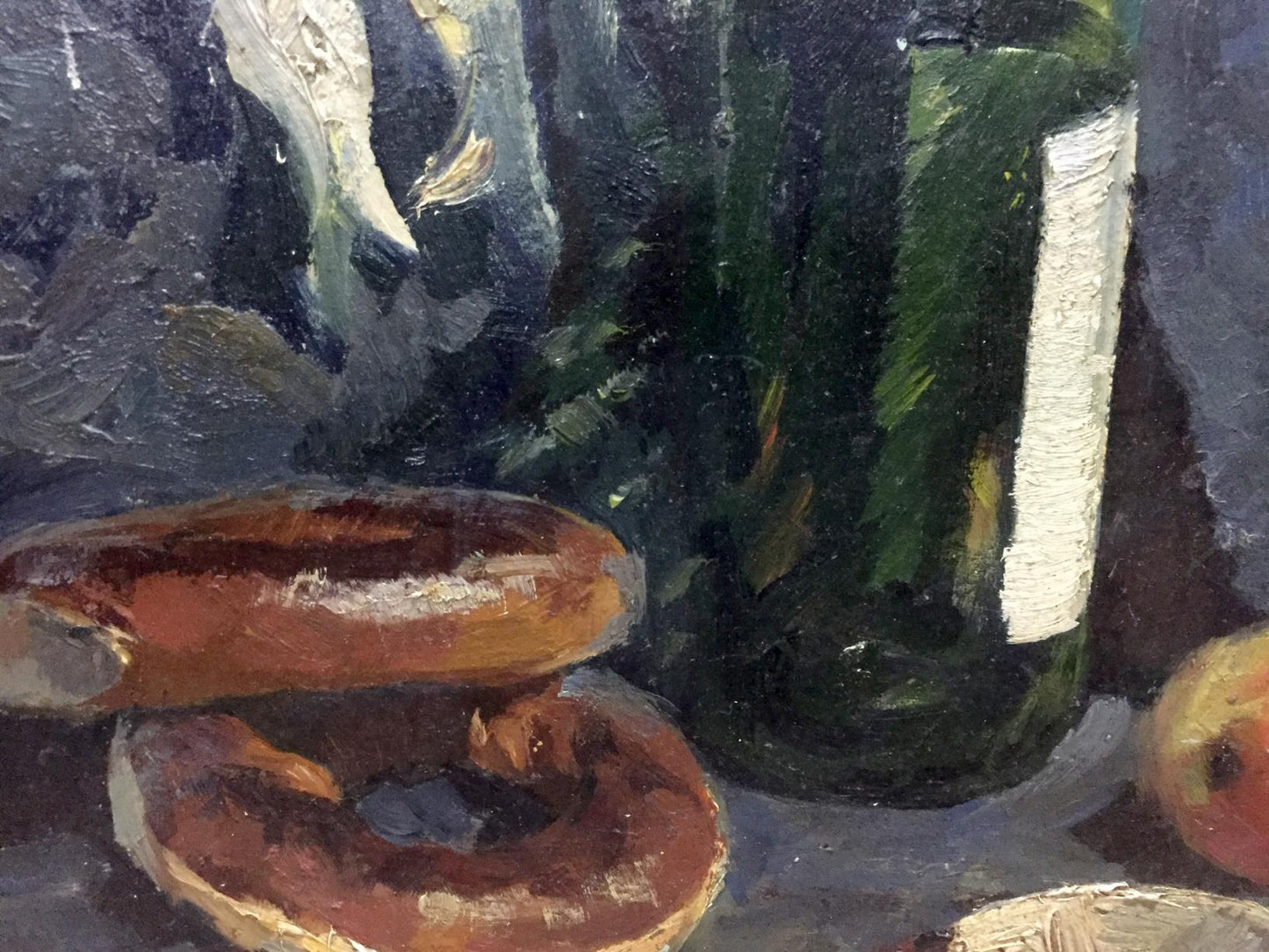 Oil painting of dark green glass bottle with white label behind two brown bagels by Khorov Alexander
