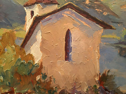 Oil painting of textured beige stucco church by river with dark roof