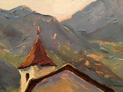 Oil painting of church by river with steeple, mountains, peach sky