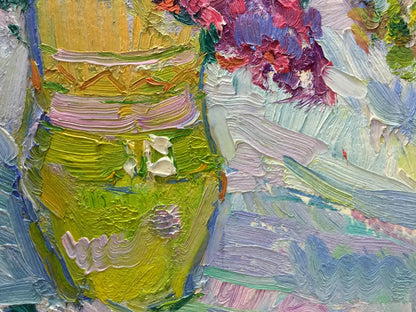 Oil painting of green vase with colorful flowers by Vasily Chegodar