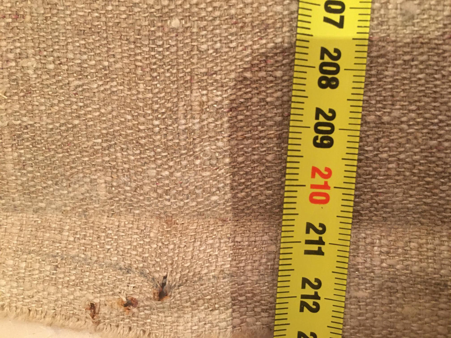 Yellow measuring tape on beige fabric in Lenin Koshtelyanchuk portrait painting