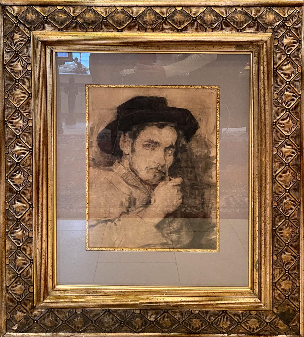 Sepia-toned sketch of man in dark hat by Ilya Efimovich Repin in ornate gold frame