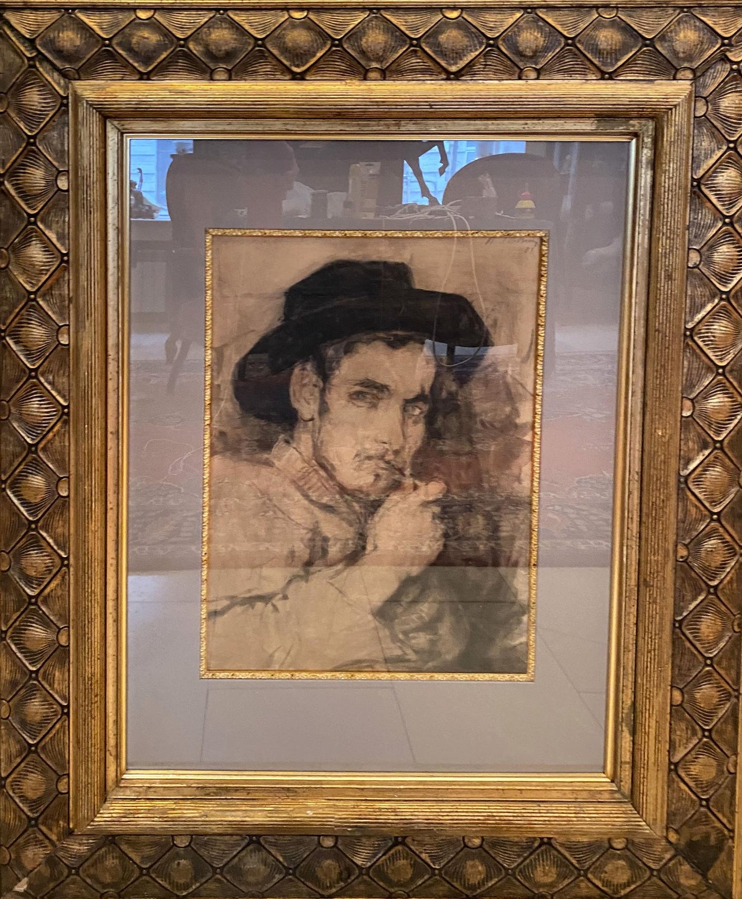 Sepia portrait sketch of man in dark hat by Ilya Repin, ornate gold frame