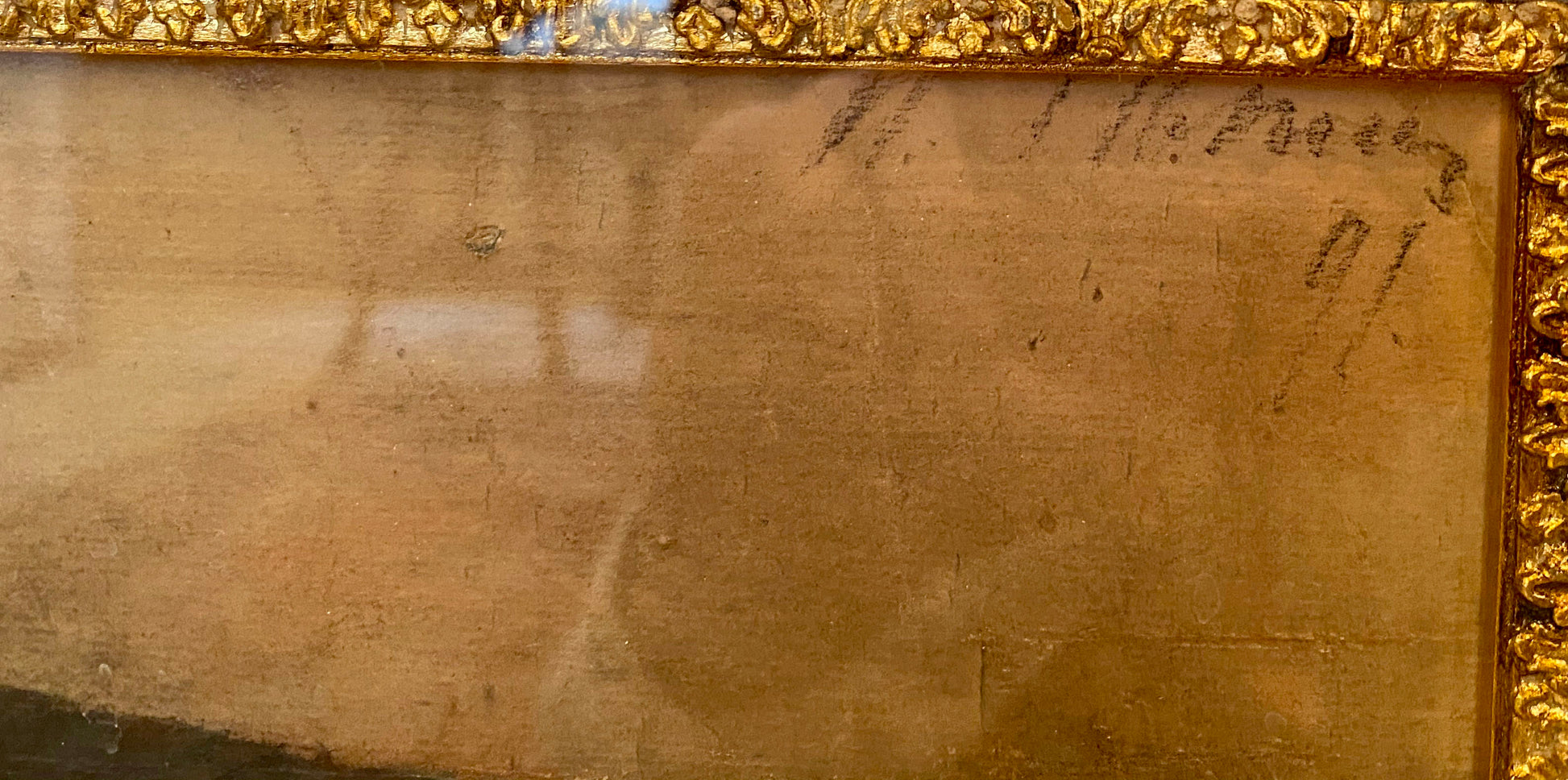 Back of gold-framed Repin portrait with handwritten inscriptions on aged beige surface