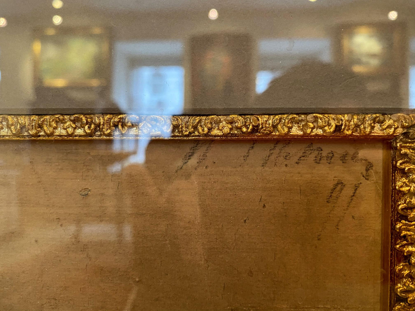 Golden ornate frame with Repin man portrait and scrollwork