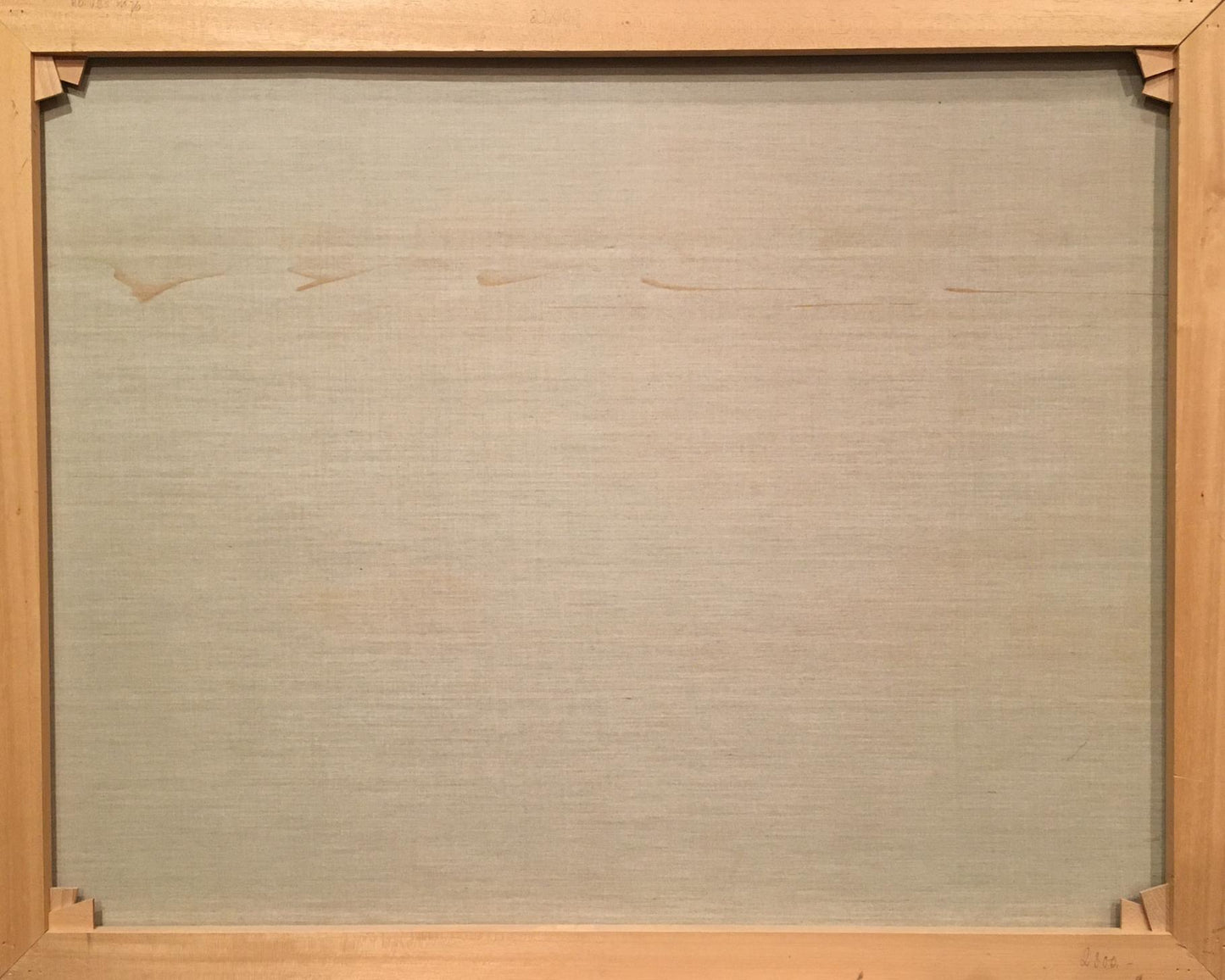 Back of Heinrich Hartung Winter landscape oil painting in light wooden frame with beige fabric