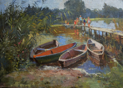 Three wooden rowboats with red and green painted interiors by Sothebys artist on waters edge
