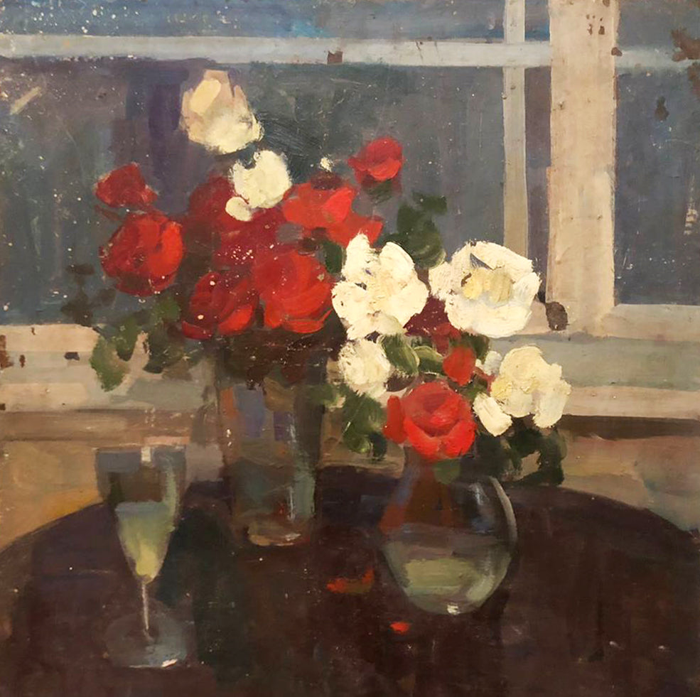 Oil painting of vibrant red and white roses in glass vase by window